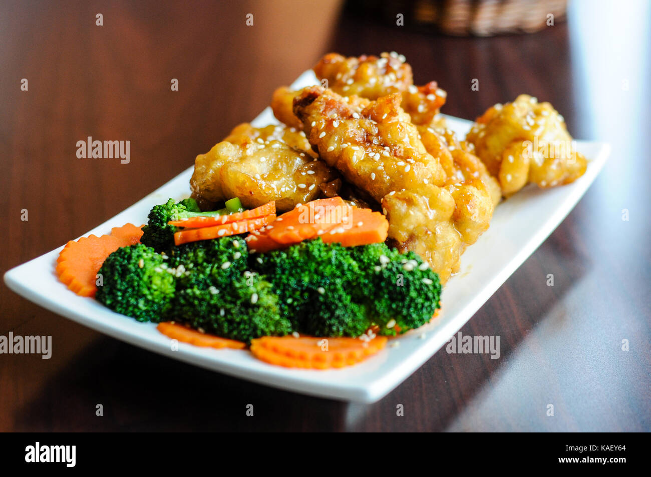 Sesame Chicken, Lightly breaded chicken with broccoli, carrots and