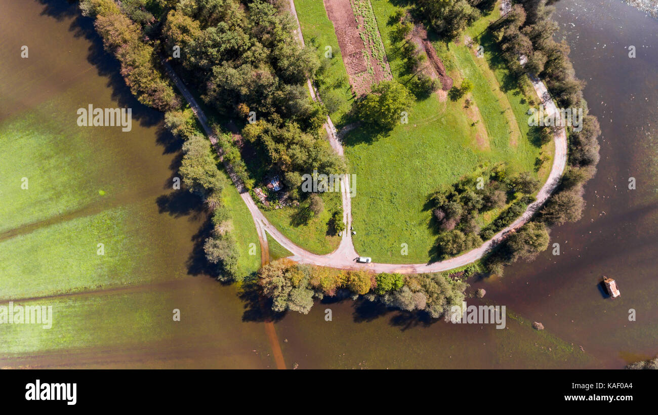 Aerial view of road surrounded with water Stock Photo - Alamy