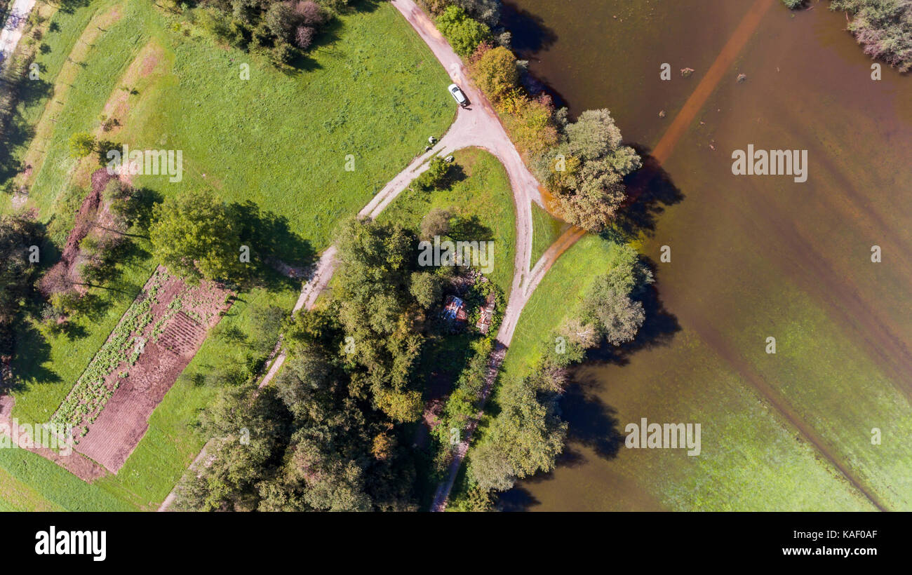 Aerial view of road surrounded with water Stock Photo - Alamy