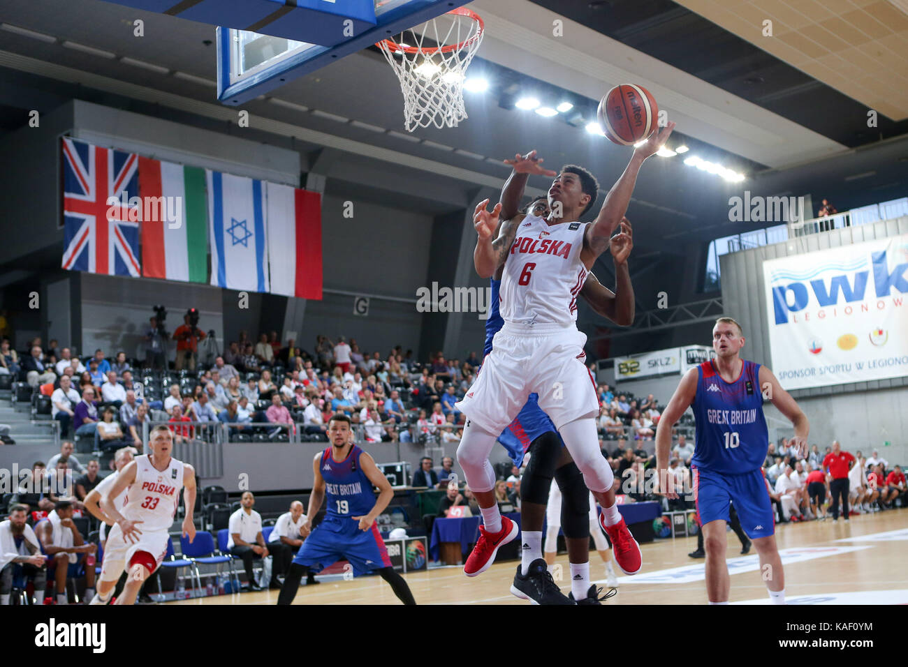 Poland play Great Britain in a basketball friendly tournament match in