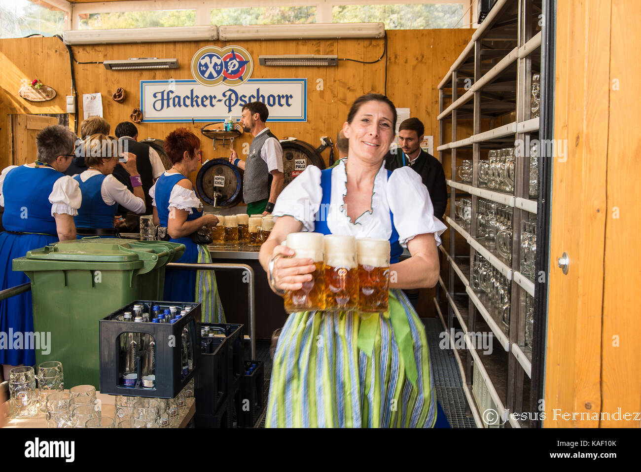 Munich,Germany-September 24,2017: A waitress smiles while rushing out ...