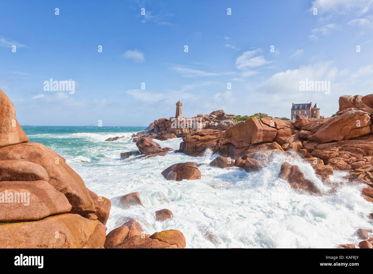 Ploumanach Mean Ruz lighthouse at pink granite coast, Perros-Guirec, Brittany, France. Stock Photo