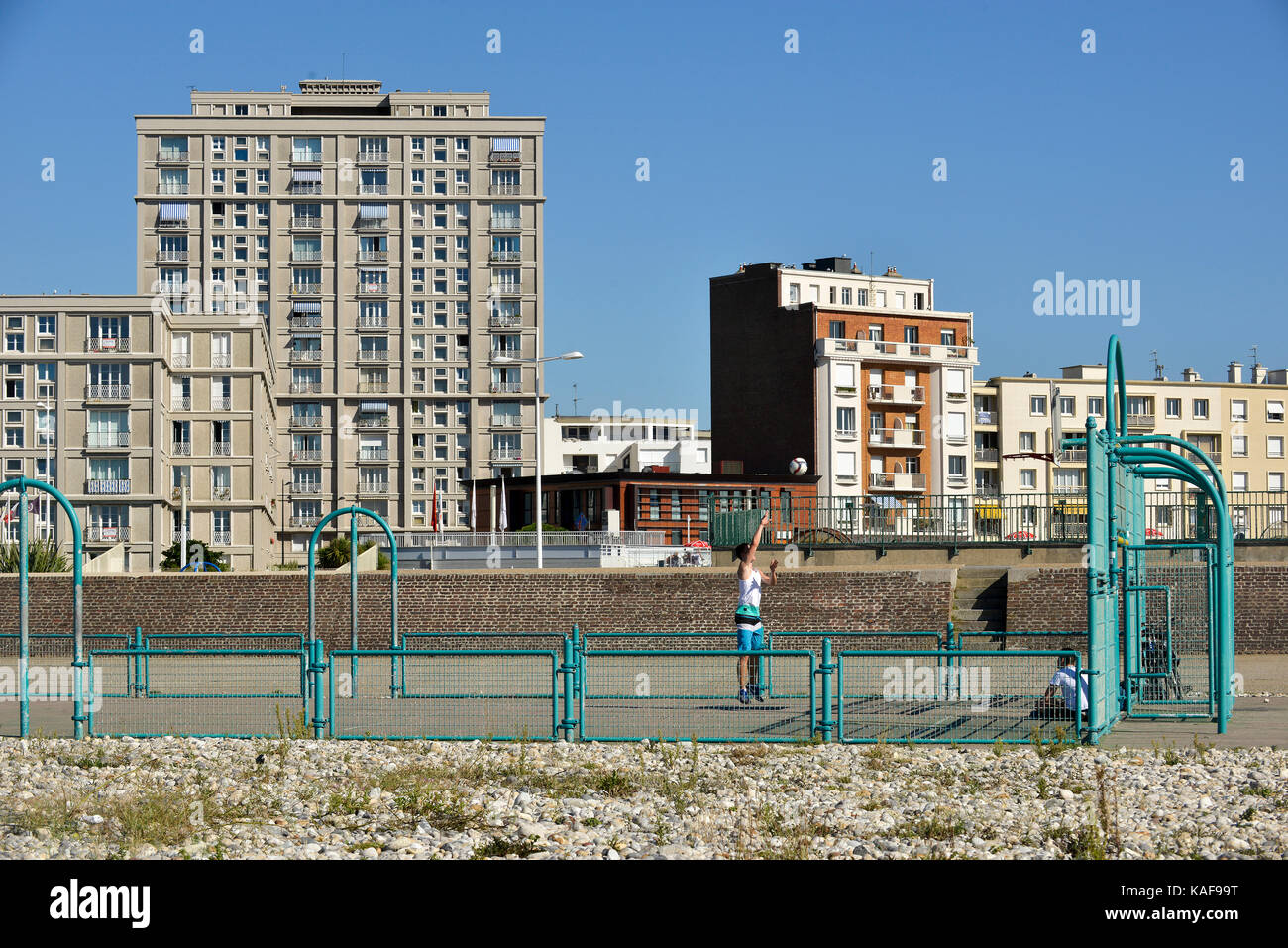 Le Havre (Normandy region, north western France): basketball court and buildings along the waterfront. Steeple of St. Joseph's Church. Buildings desig Stock Photo
