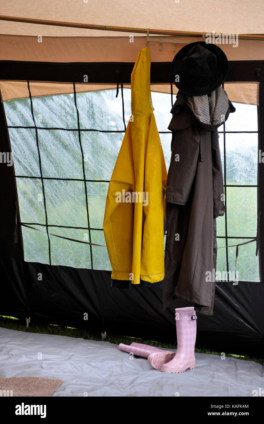 Wet Weather Clothing And Footwear Hung Up To Dry In Caravan Awning Wet Weather Clothing And Footwear Hung Up To Dry In Caravan Awning