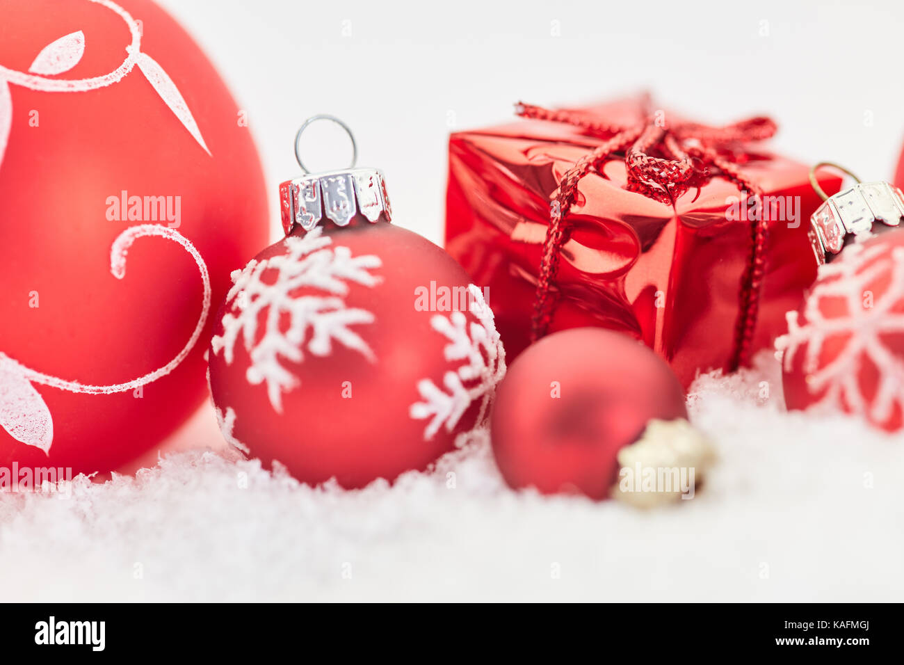 Christmas background with gift and baubles in red Stock Photo - Alamy