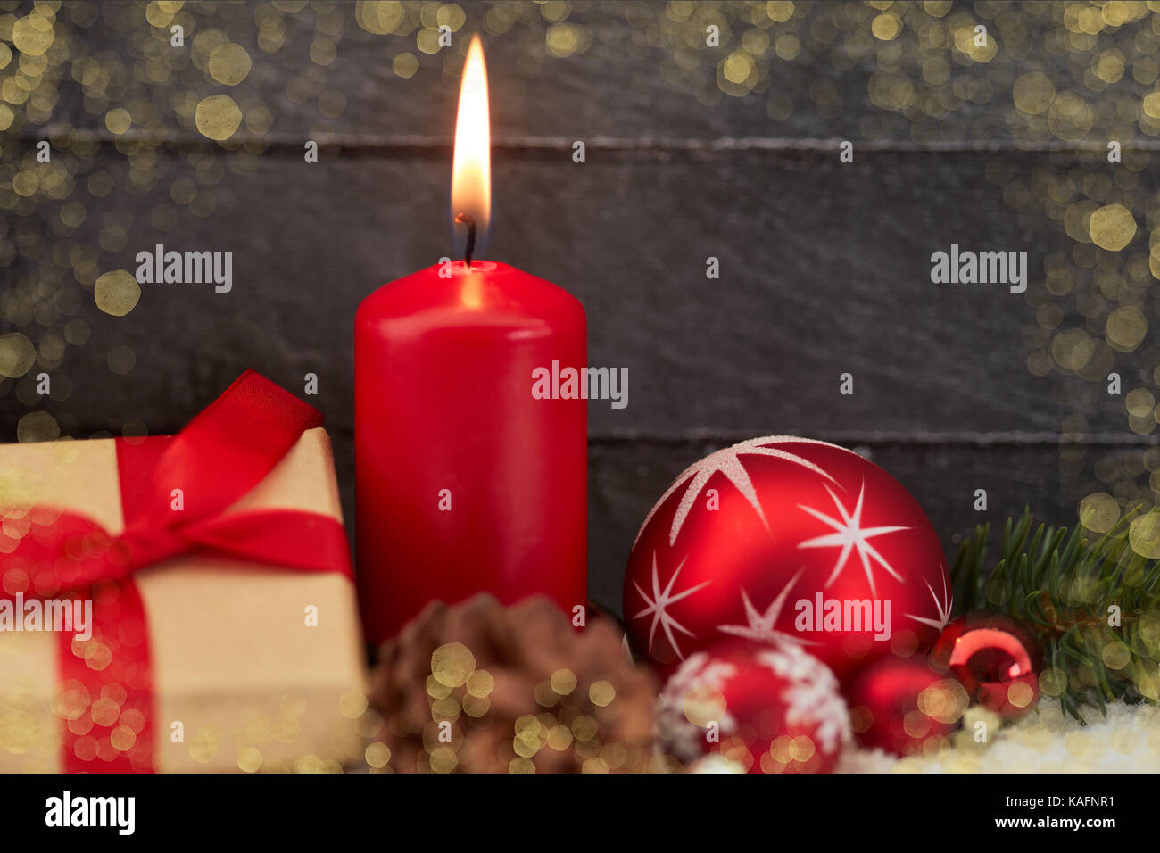 Christmas card with candle and gift in golden frame Stock Photo - Alamy
