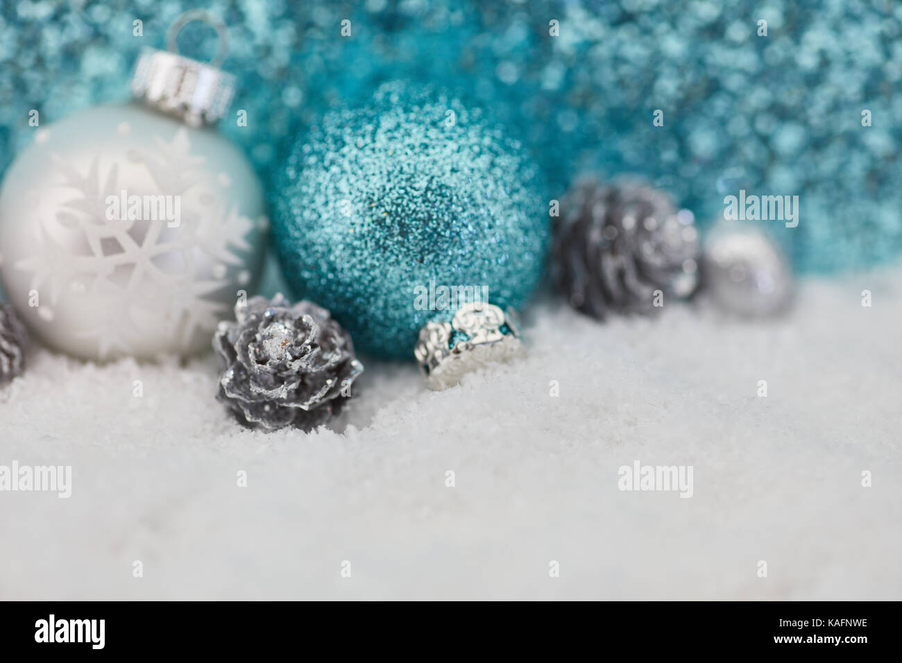 Christmas winter background with baubles on snow Stock Photo