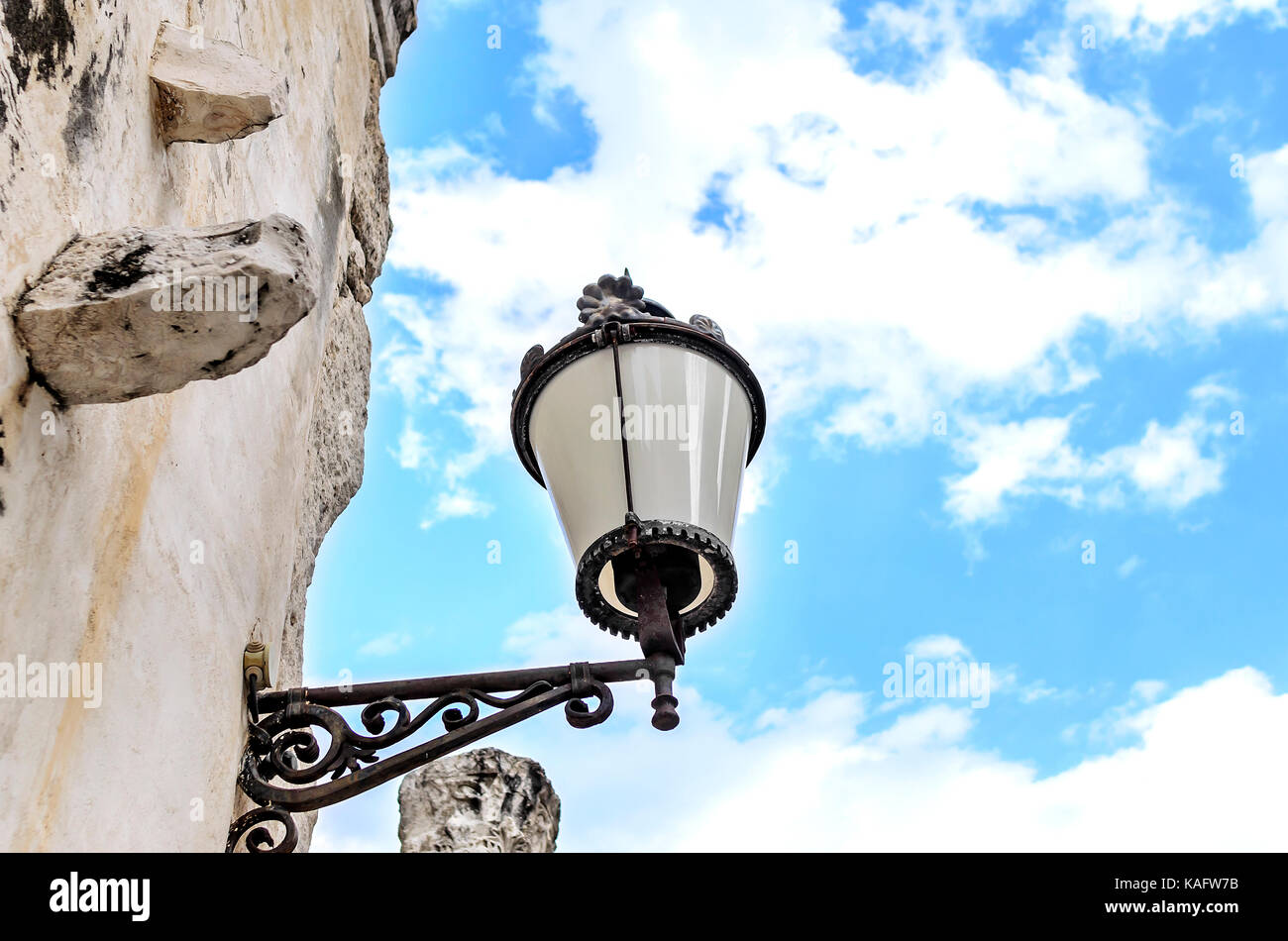 Street lamp on the facade of the house. Stock Photo