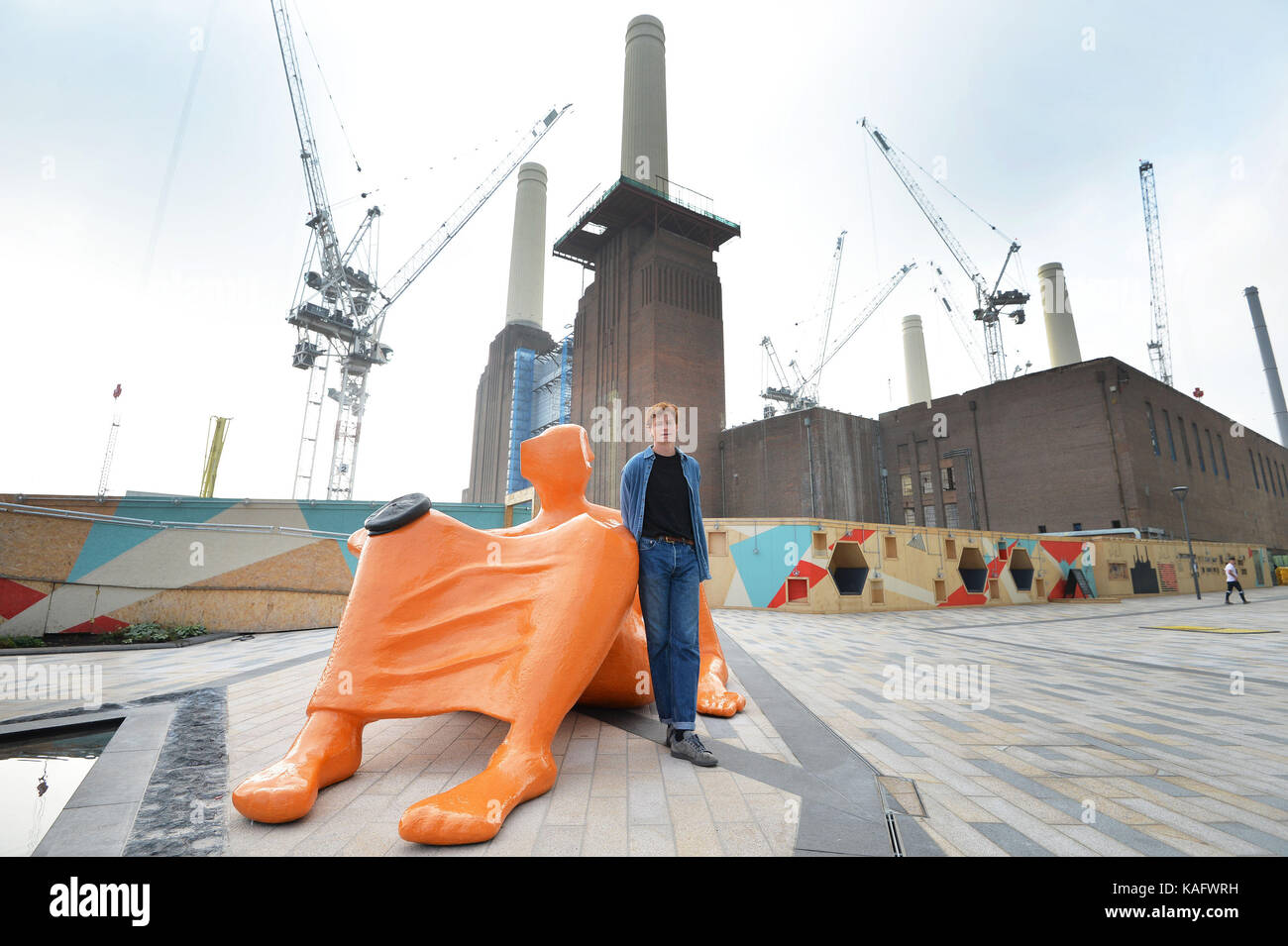 Jesse Wine stands by his Sculpture 'Local Vocals' as part of the inaugural Powerhouse Commission on the embankment in front of Battersea Power Station, London. Stock Photo