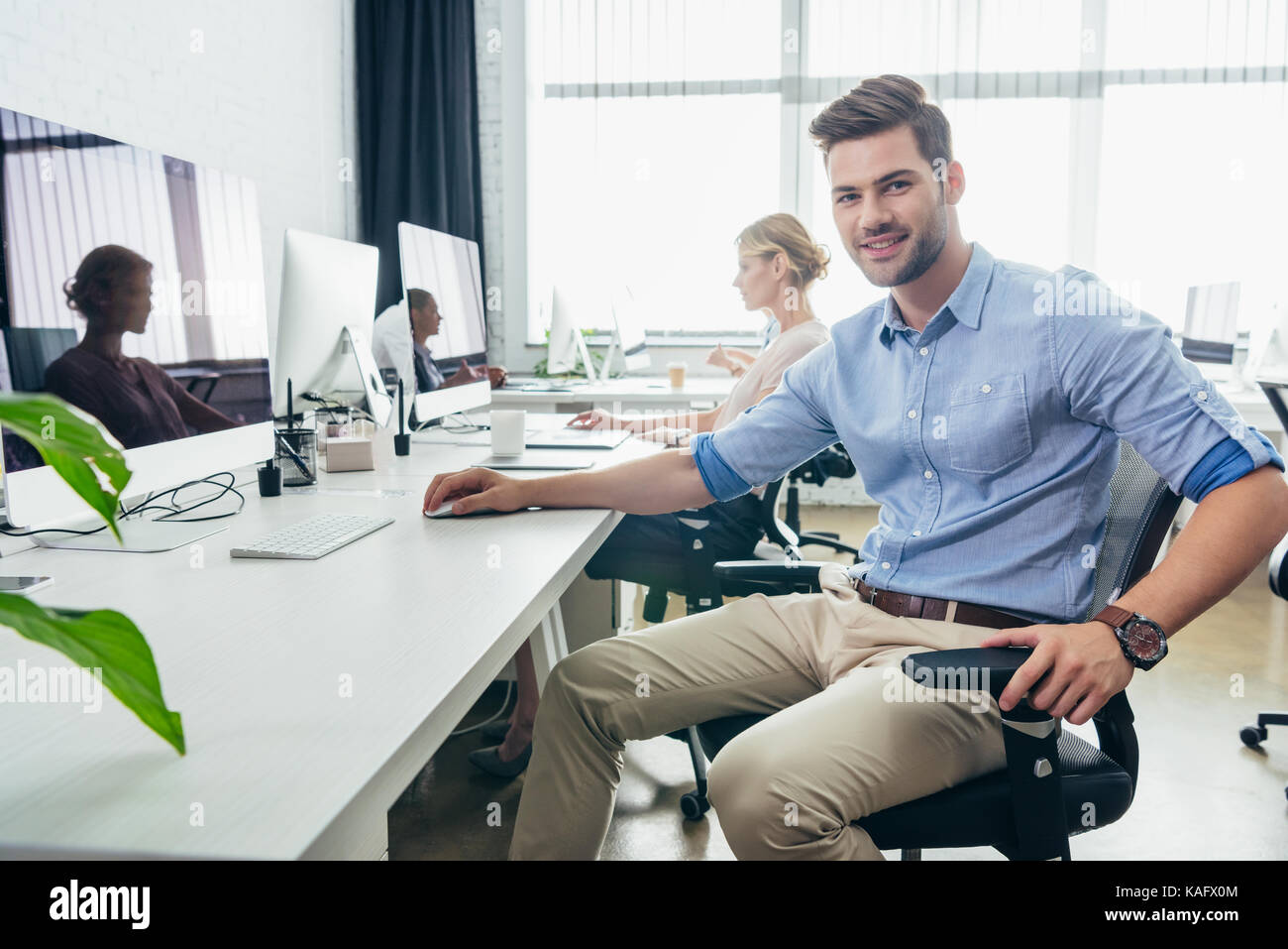 handsome businessman in office Stock Photo - Alamy