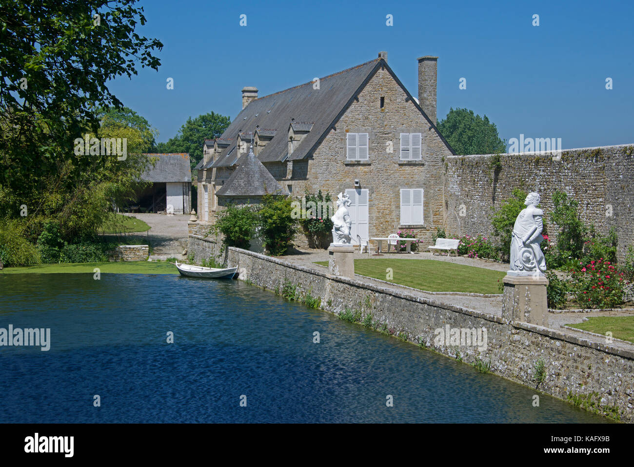 Lake and outhouse Villa Normanda Saint Marcouf  Cotentin Peninsular Normandy France Stock Photo