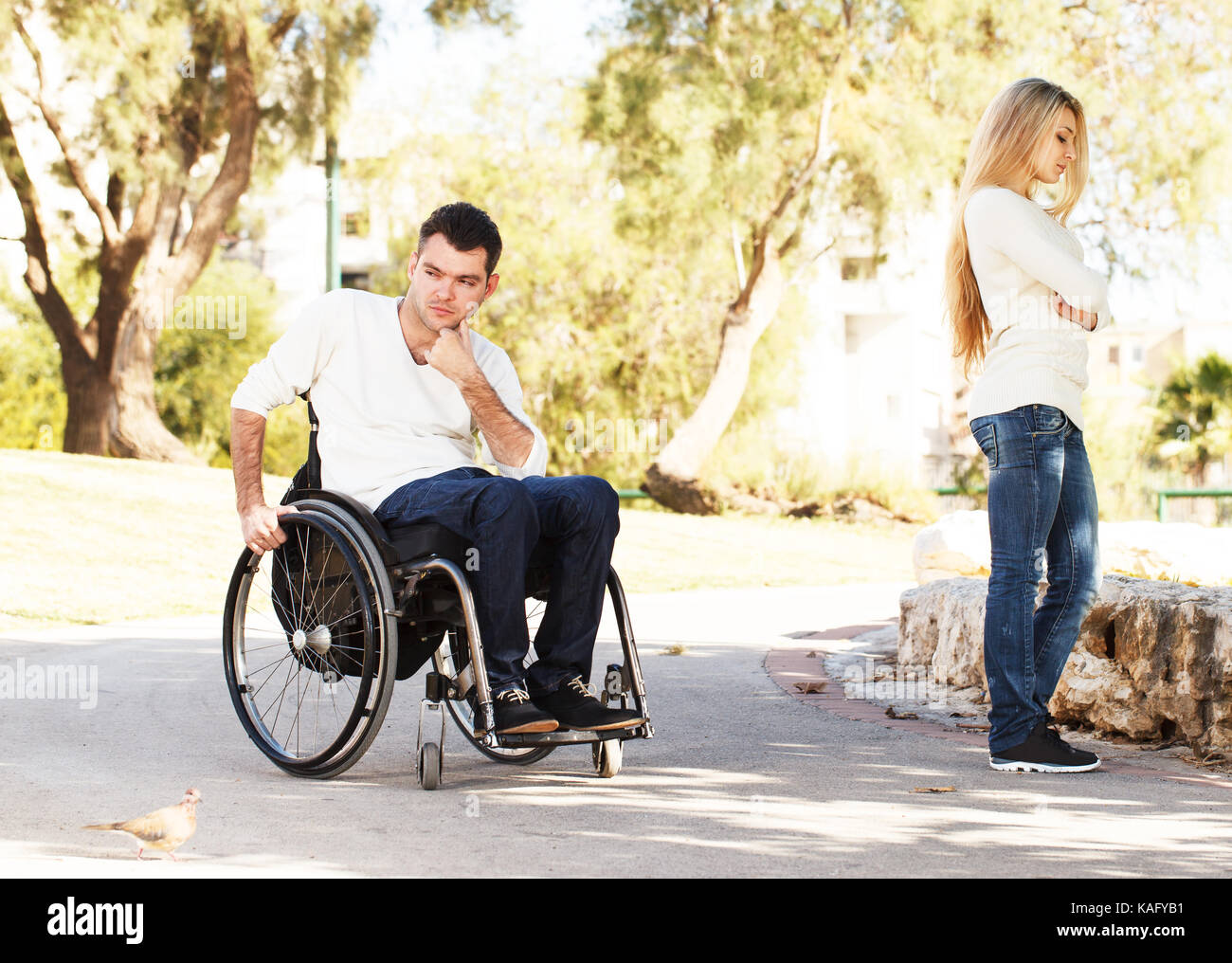 Disabled man and his girlfriend quarreled Stock Photo