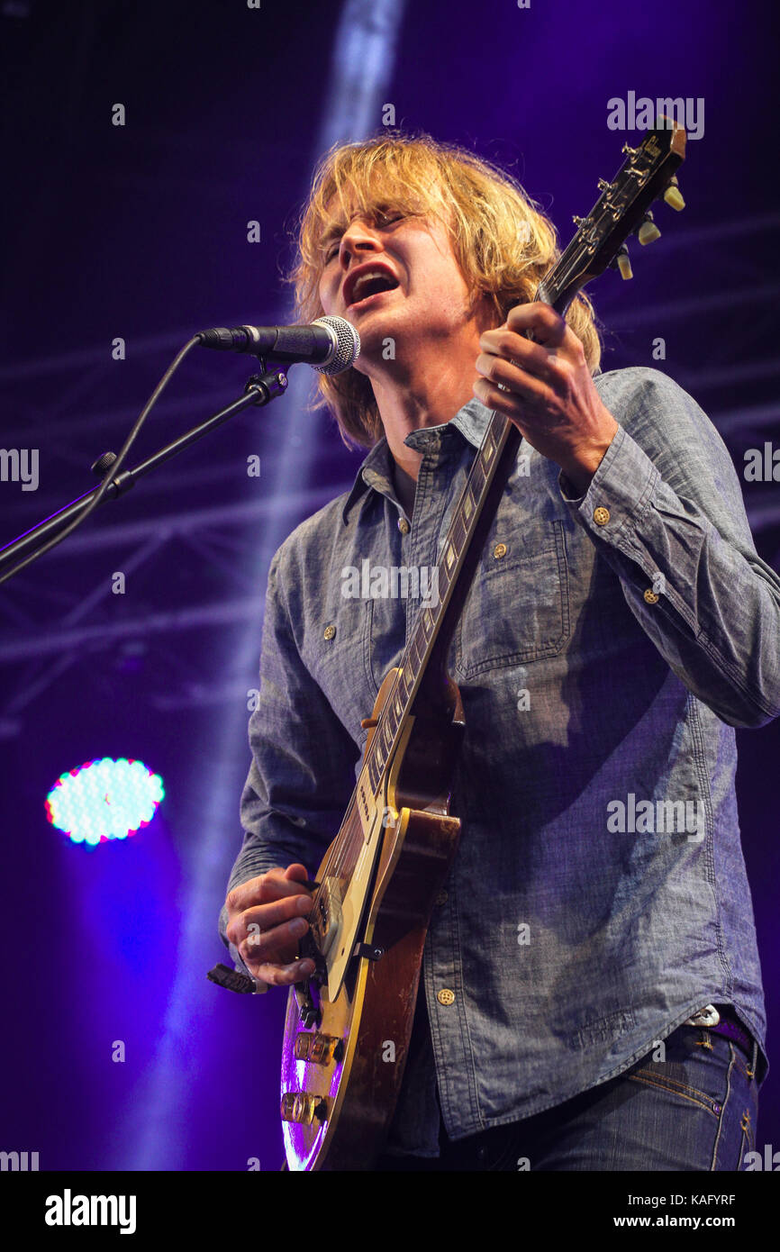 The Norwegian rock band BigBang performs a live concert at the Norwegian music festival Hovefestivalen 2012. Here band frontman, singer and musician Øystein Greni is pictured live on stage. Norway, 29/06 2012. Stock Photo