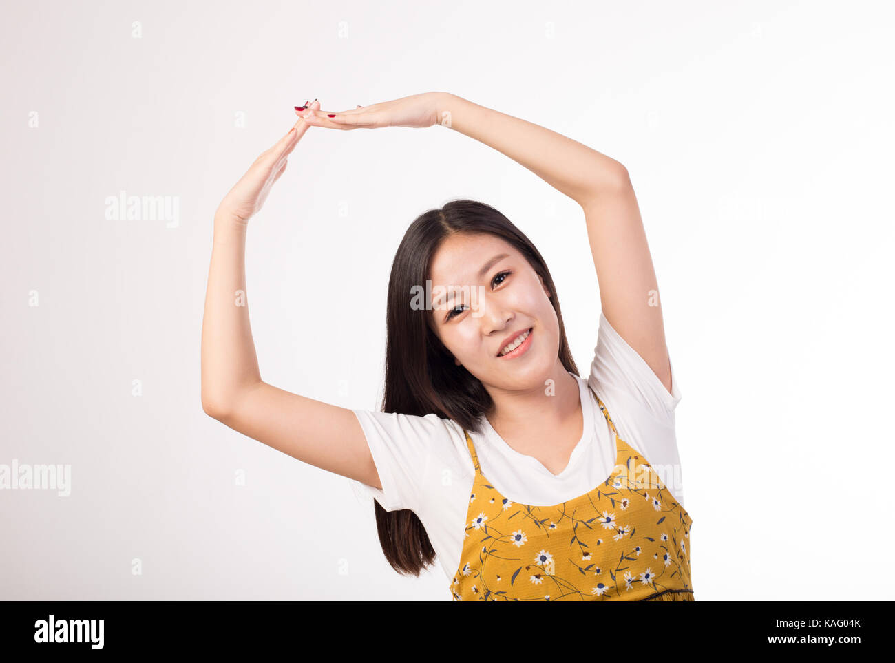 Asian girl on yellow background hi-res stock photography and images - Alamy