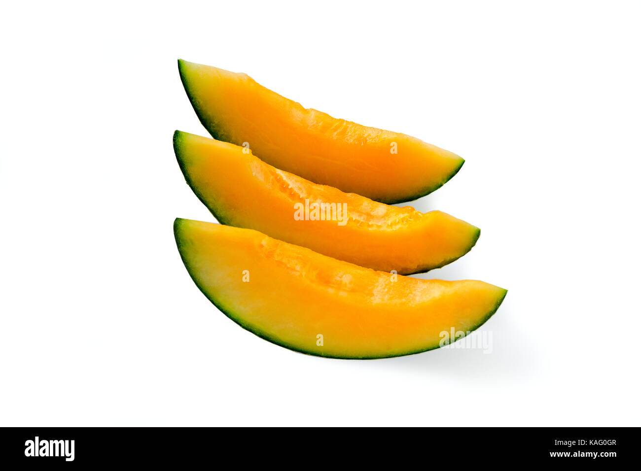 Cut pieces of ripe yellow melon. Seedless. Isolated Stock Photo