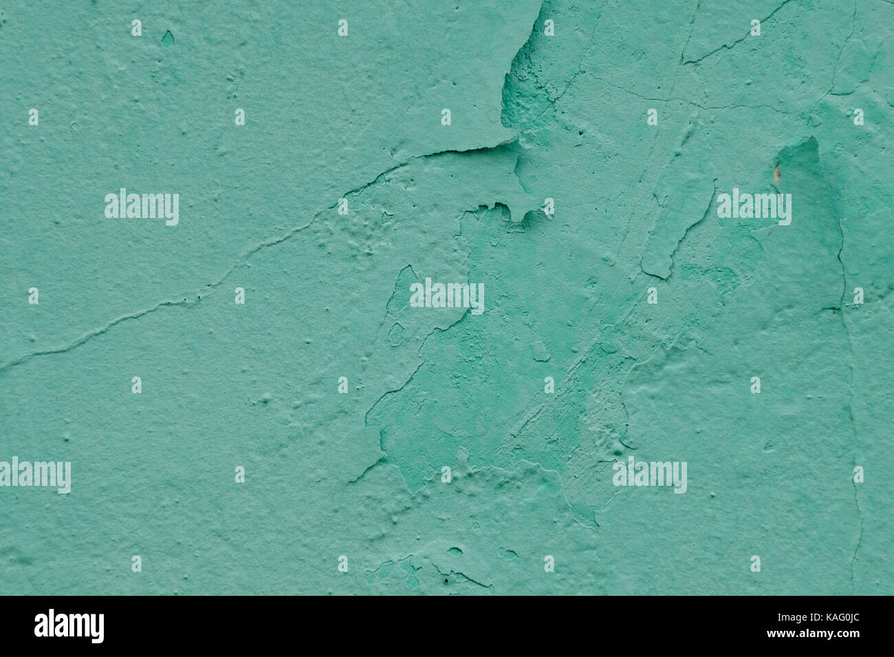 Wall with old exfoliating paint mint color Stock Photo