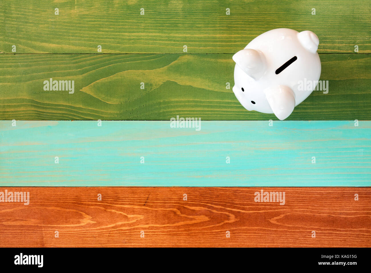 Piggy bank on color wooden background,Saving or financial investment ...