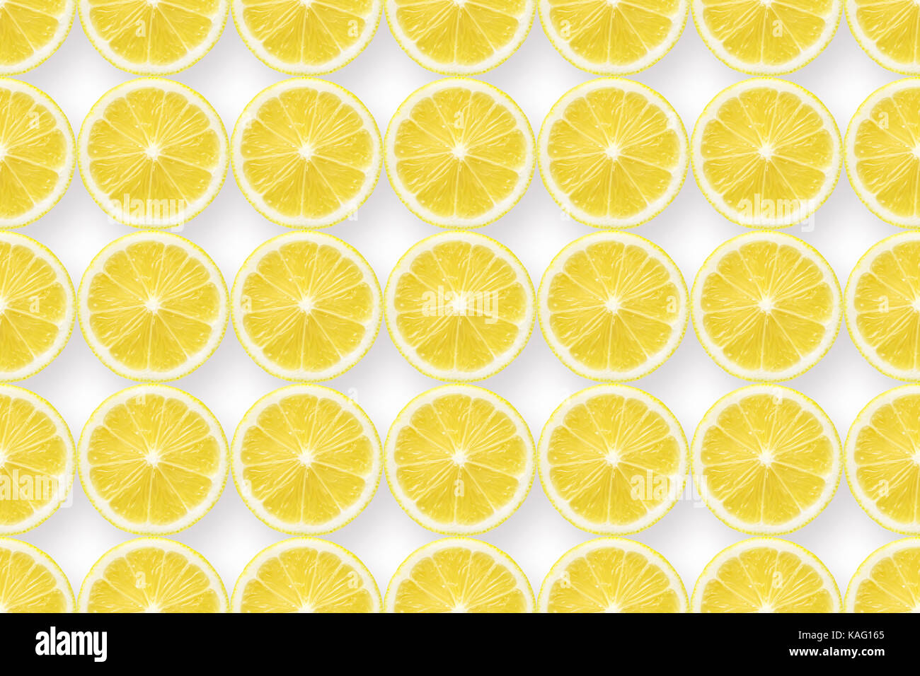 huge detailed background made from many lemon slices on white, seamless pattern Stock Photo