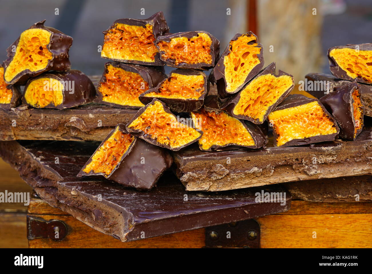 Crunchy chocolate covered candy Stock Photo Alamy