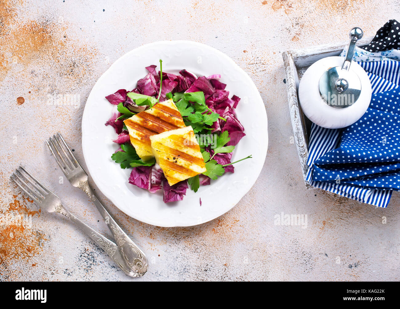 salad with fried cheese on white plate Stock Photo