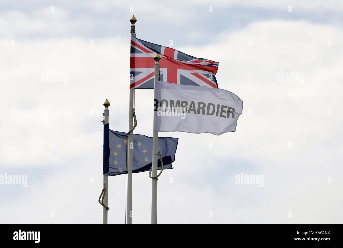 Flags fly above the Bombardier Aerospace plant in Belfast, as a preliminary US finding on a trade dispute which could threaten thousands of Northern Irish jobs is due later. Stock Photo