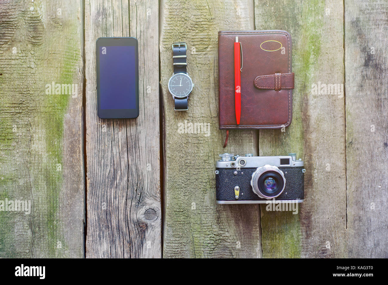 things to bring when travelling abroad, phone, camera, watch, note Stock Photo