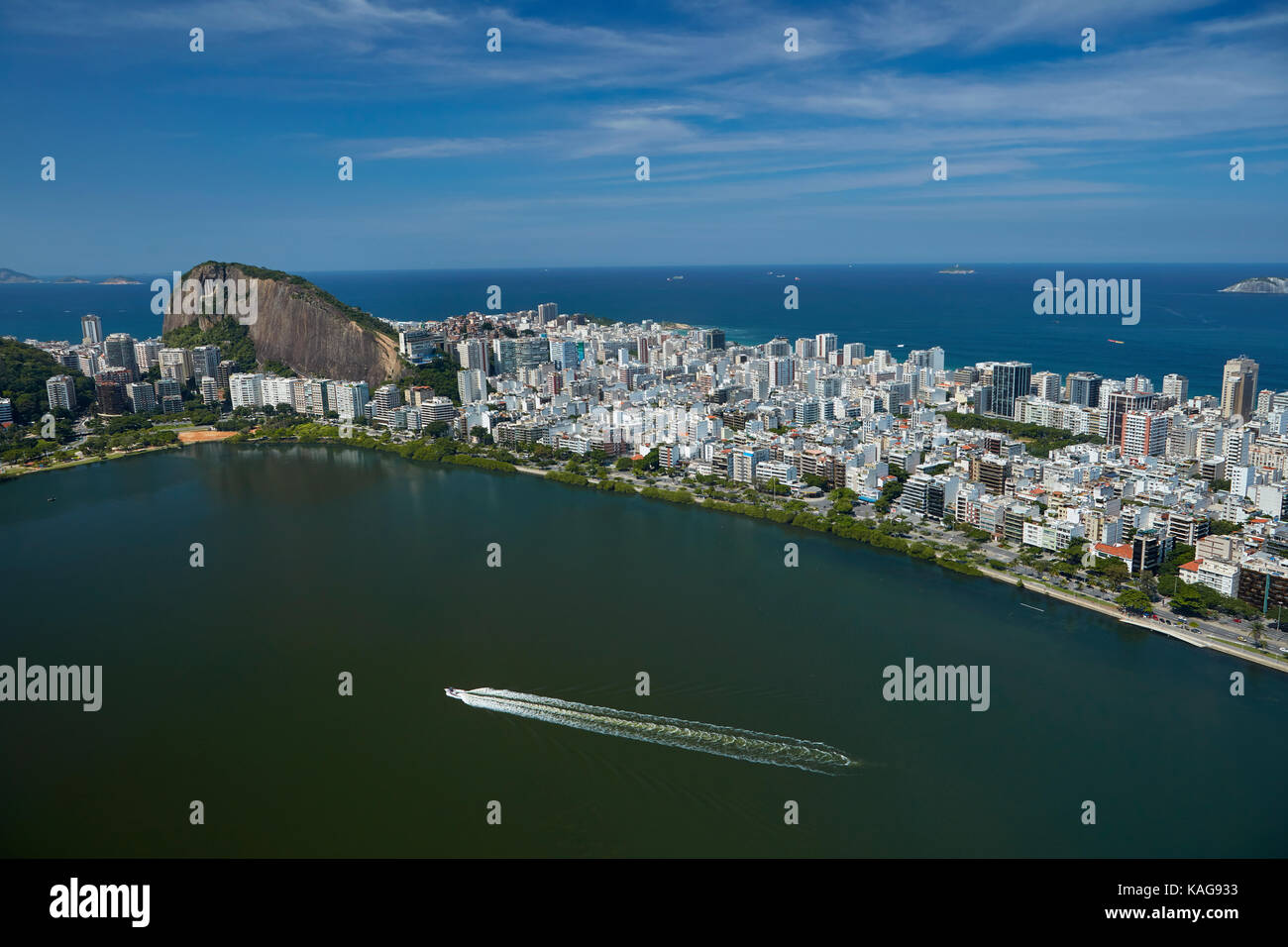 Boat on Rodrigo de Freitas Lagoon, and Ipanema, Rio de Janeiro, Brazil, South America - aerial Stock Photo