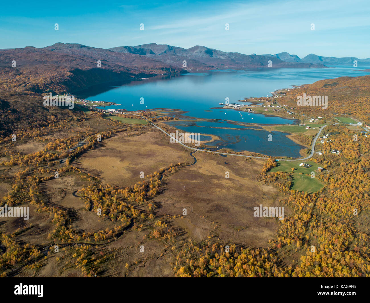 Aerial drone view of norwegian fjord surrounded by mountains and autumn nature, Dåfjord (Dafjord) Ringvassøya (Ringvassoya), Norway Stock Photo