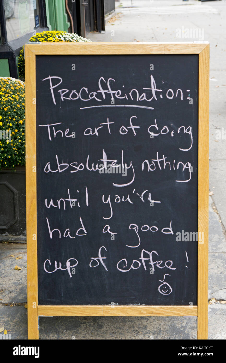 A sign outside a coffee shop on Court Street in Cobble Hill coining a new word procaffeination, the srt of procrastinating until one has had coffee. Stock Photo