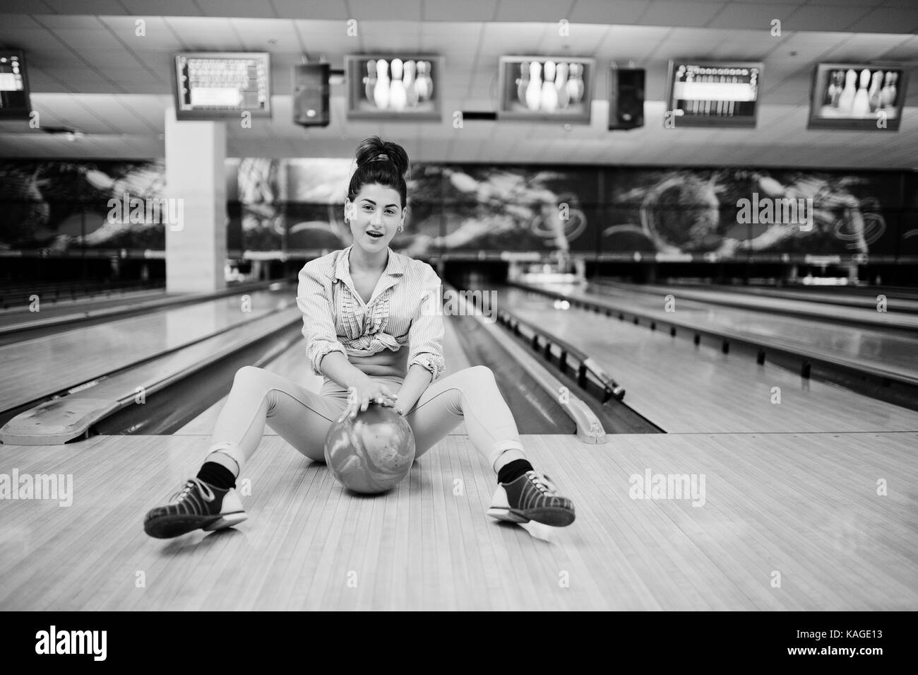Girl with bowling ball on alley played at bowling club Stock Photo Alamy