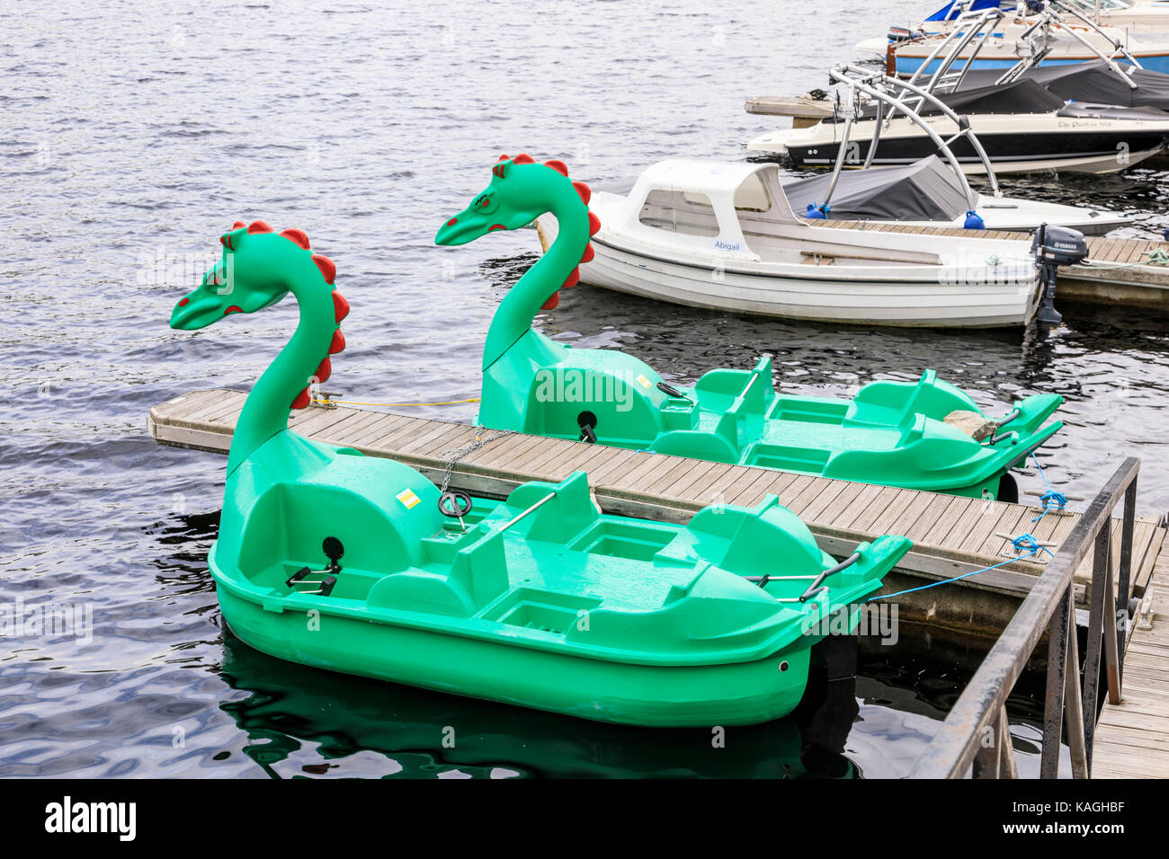 Pair of green Nessie pedalos or paddle boats Stock Photo