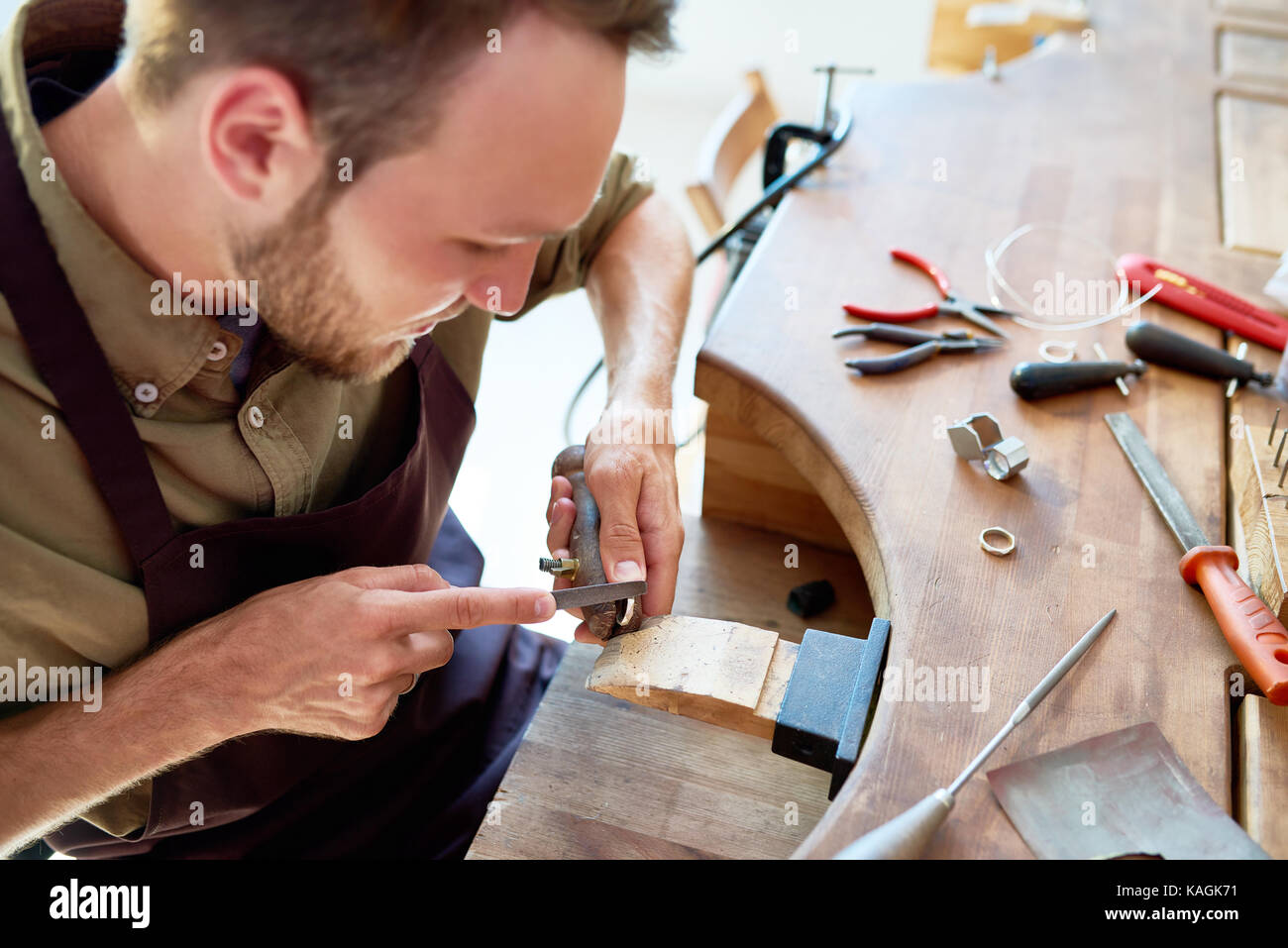 Jeweler Making Ring in Workshop Stock Photo