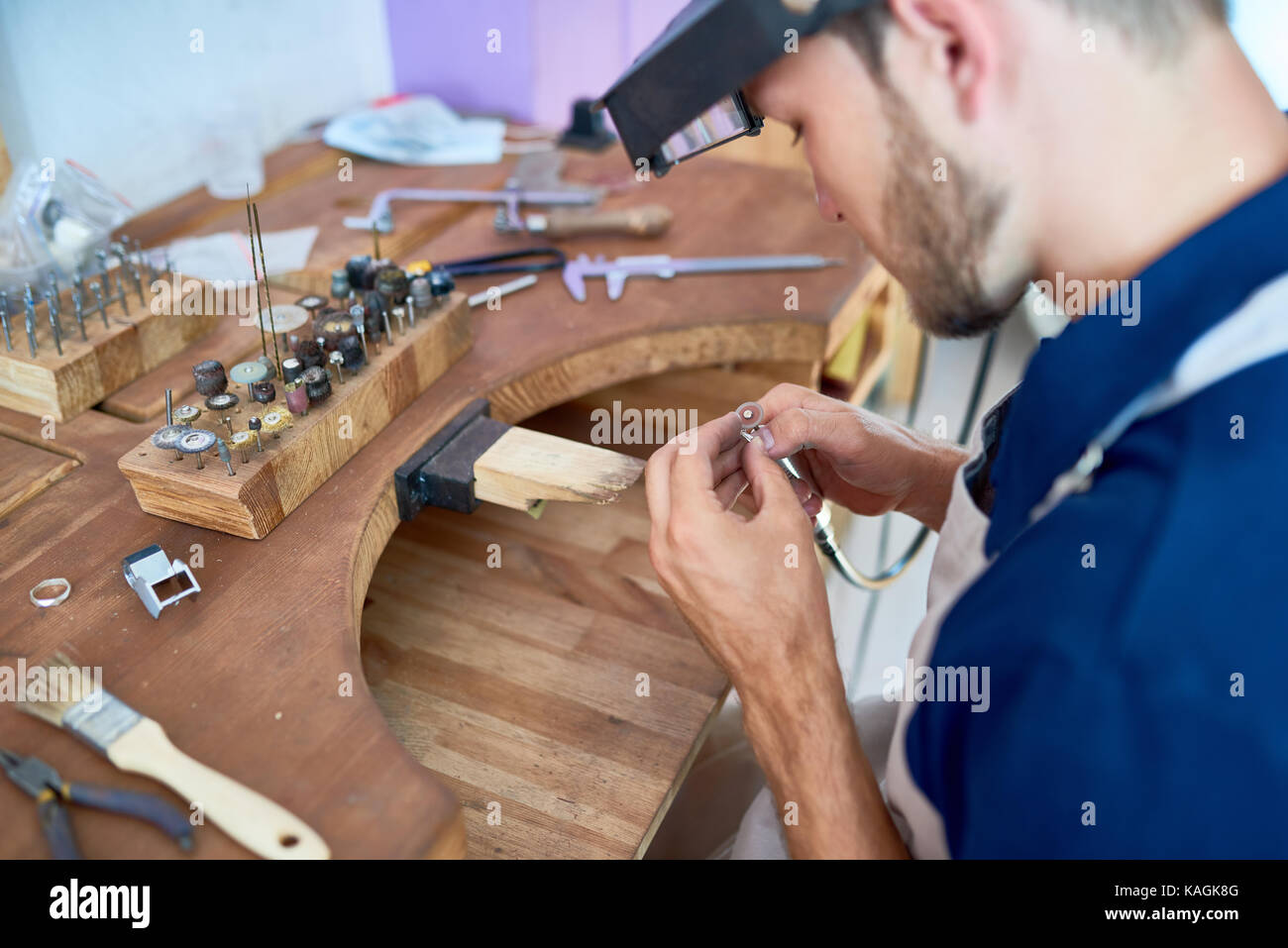 Craftsman Making Jewelry in Workshop Stock Photo - Alamy