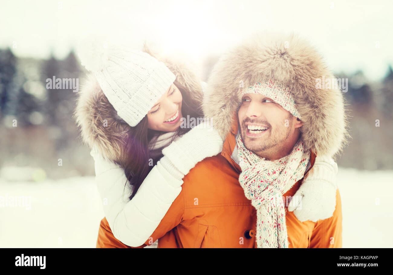 happy couple having fun over winter background Stock Photo