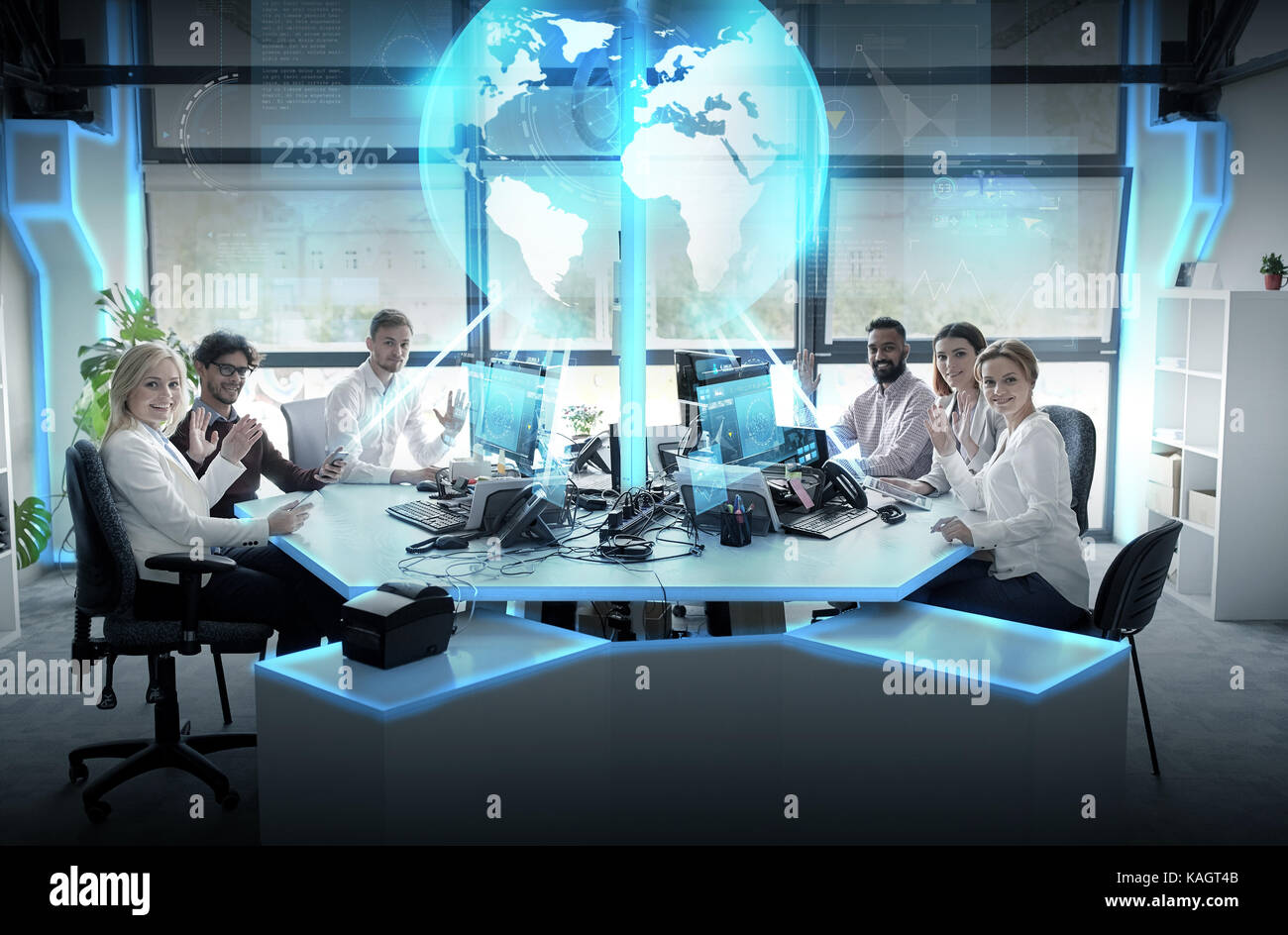 happy business team with earth hologram at office Stock Photo