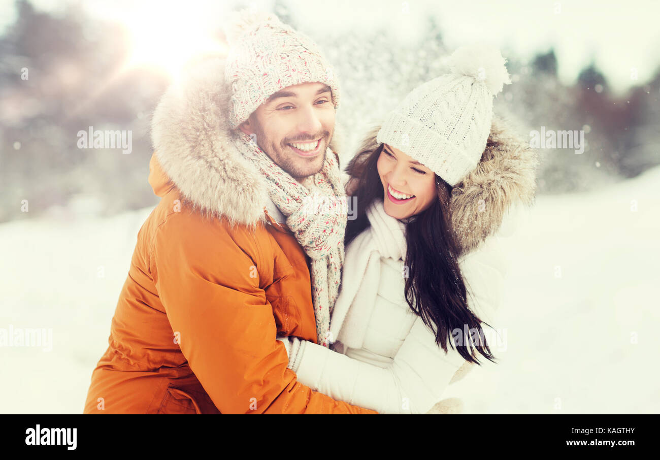 happy couple hugging and laughing in winter Stock Photo - Alamy