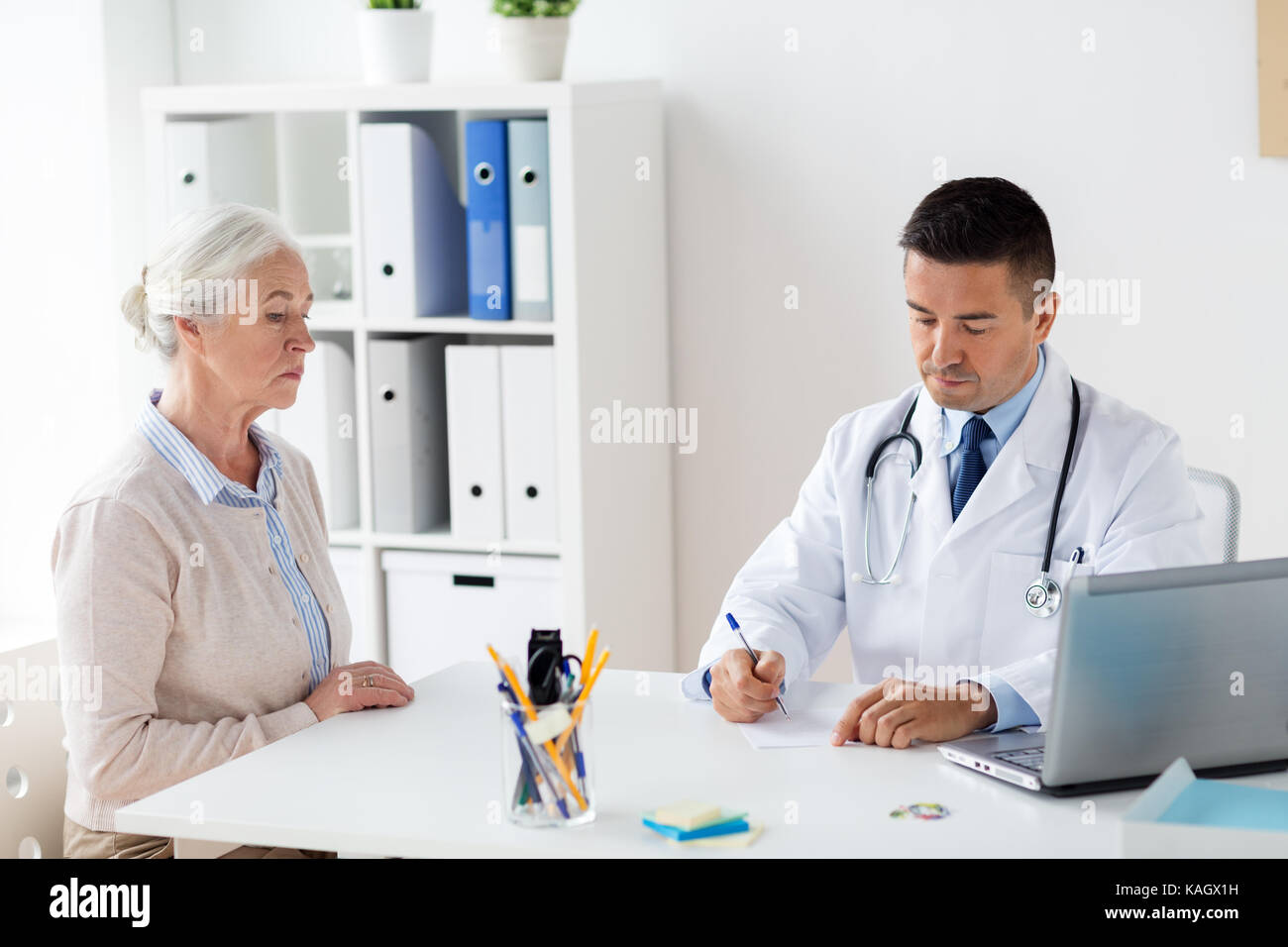 woman and doctor with prescription at clinic Stock Photo