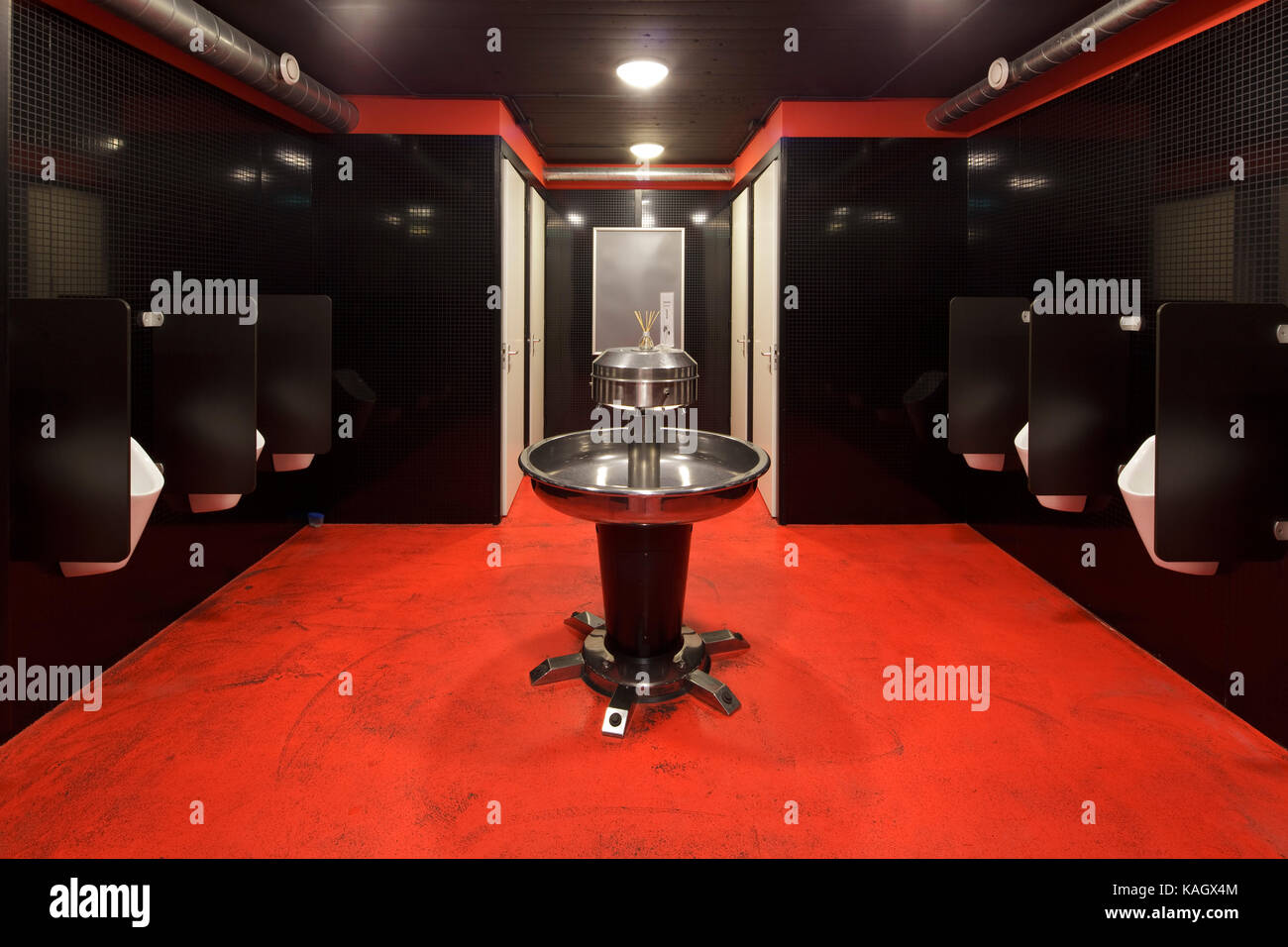 Gents Cloakroom With Red Flooring And Black Walls