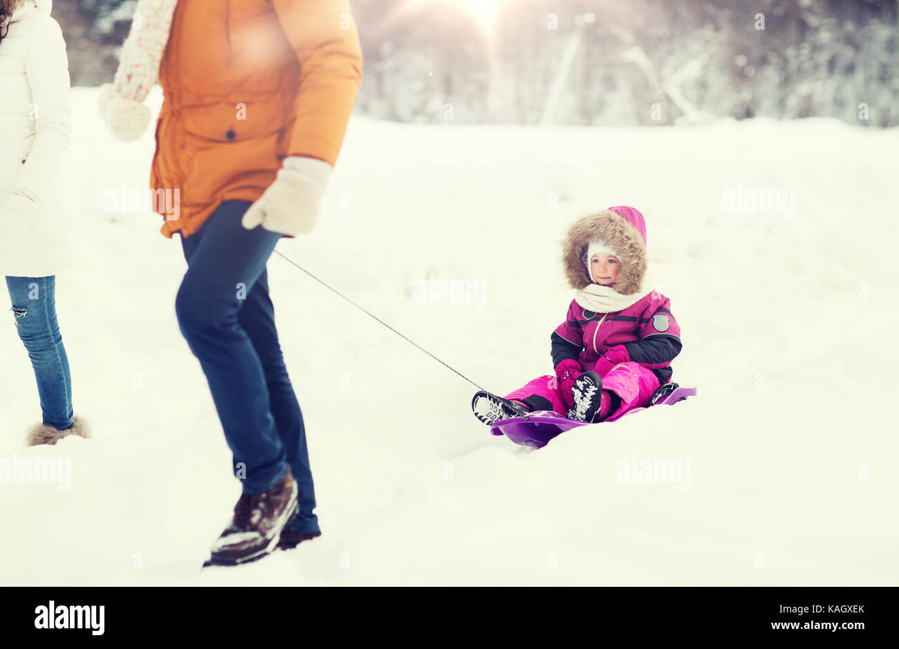happy family with sled walking in winter forest Stock Photo - Alamy