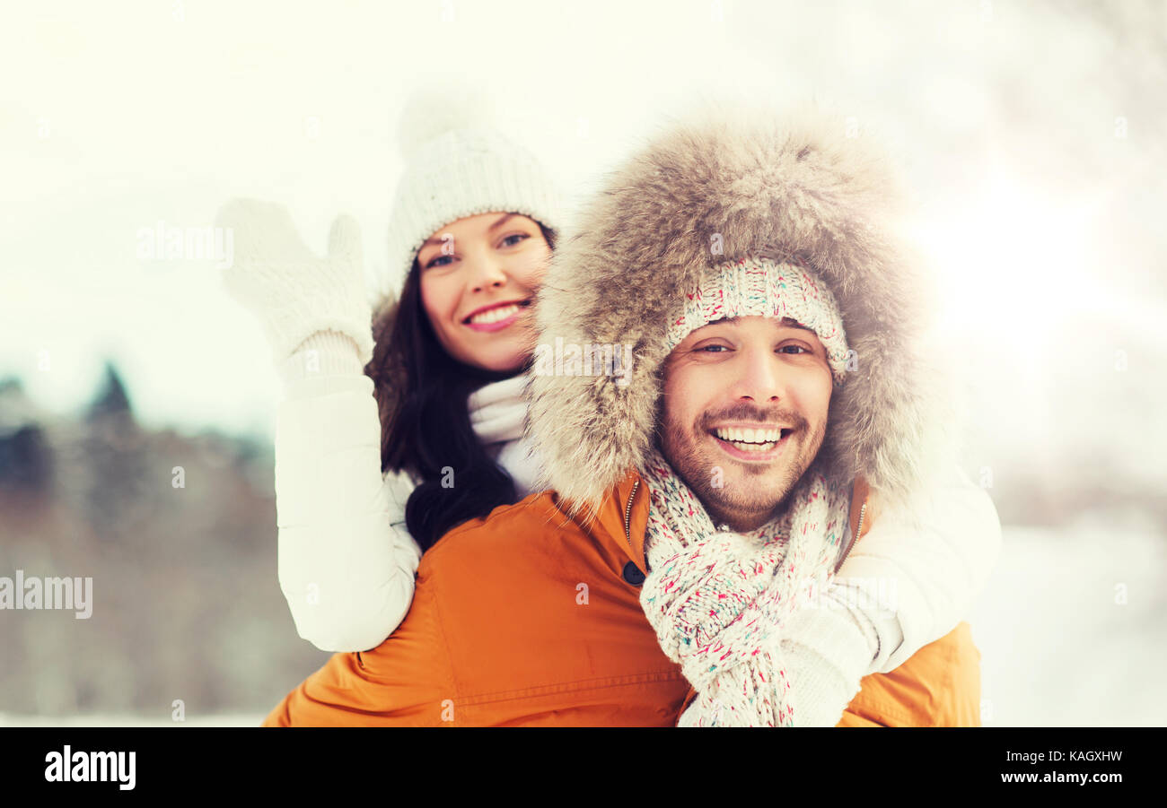 happy couple having fun over winter background Stock Photo