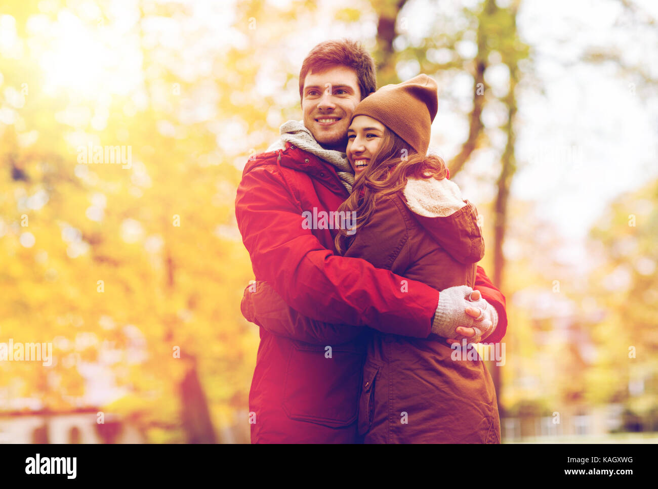 happy young couple hugging in autumn park Stock Photo - Alamy
