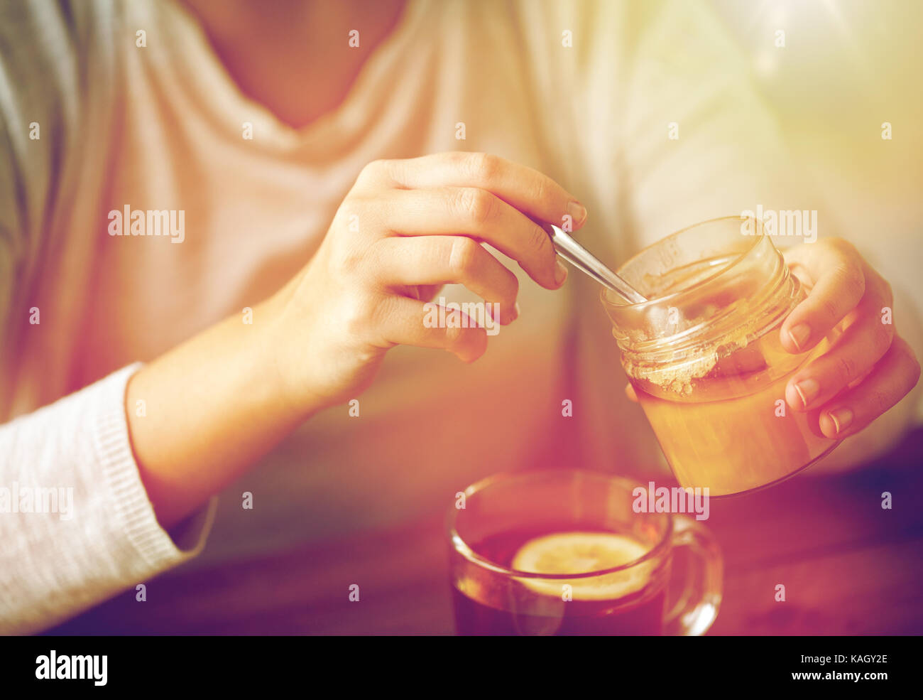 Adding Honey To Tea