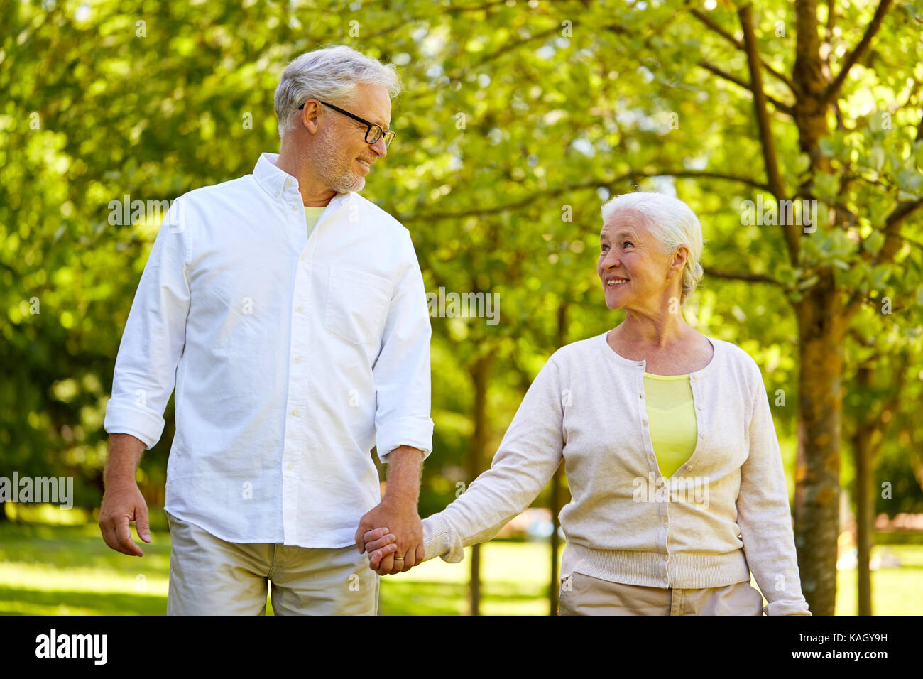 happy senior couple walking at summer park Stock Photo - Alamy