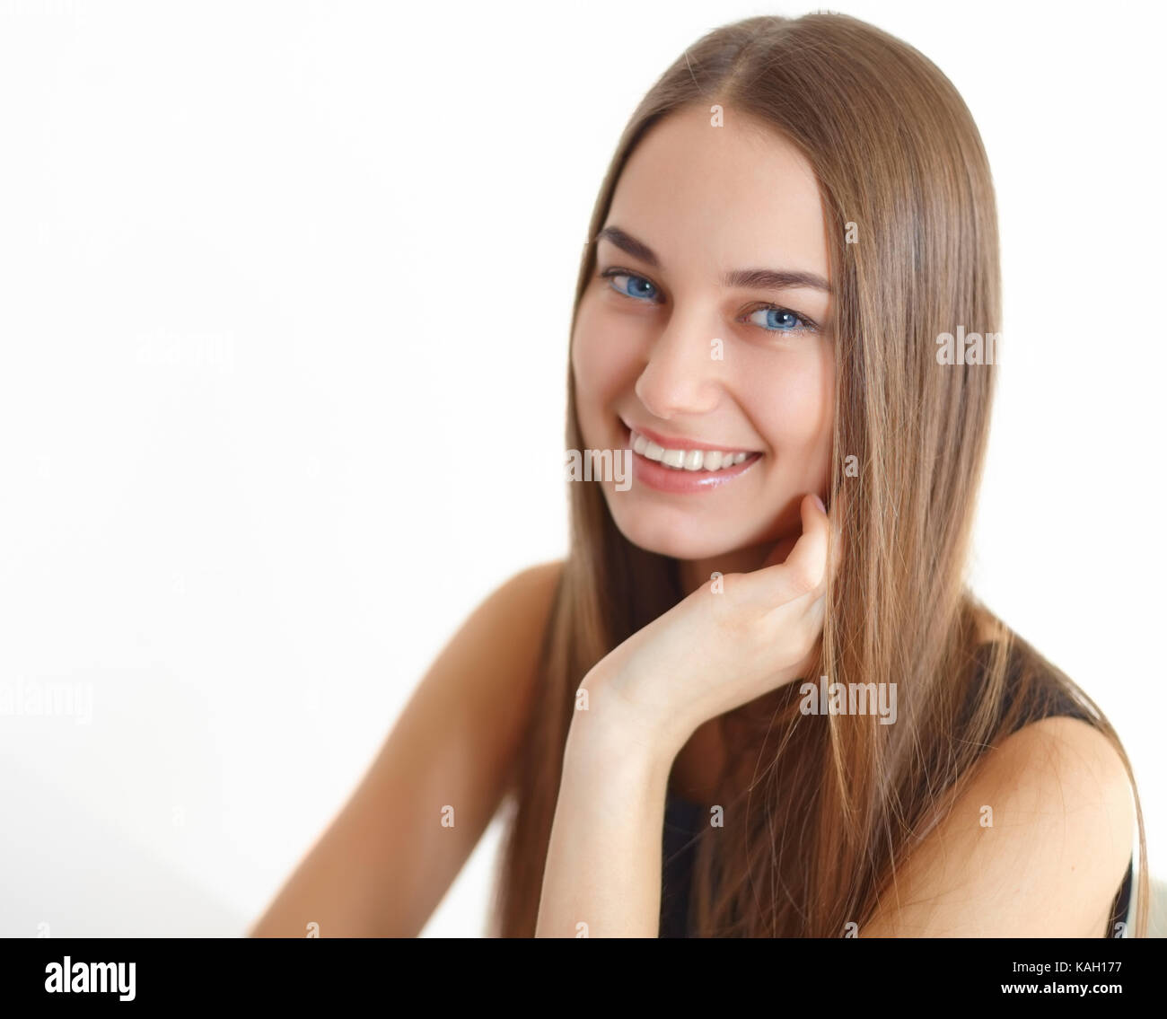 Close-up portrait of beautiful young smiling woman isolated on white ...