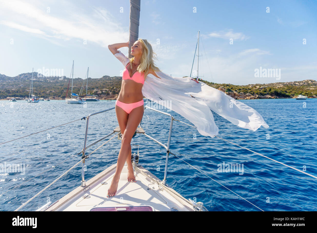 woman relaxing on a cruise boat wearing tunic Stock Photo - Alamy