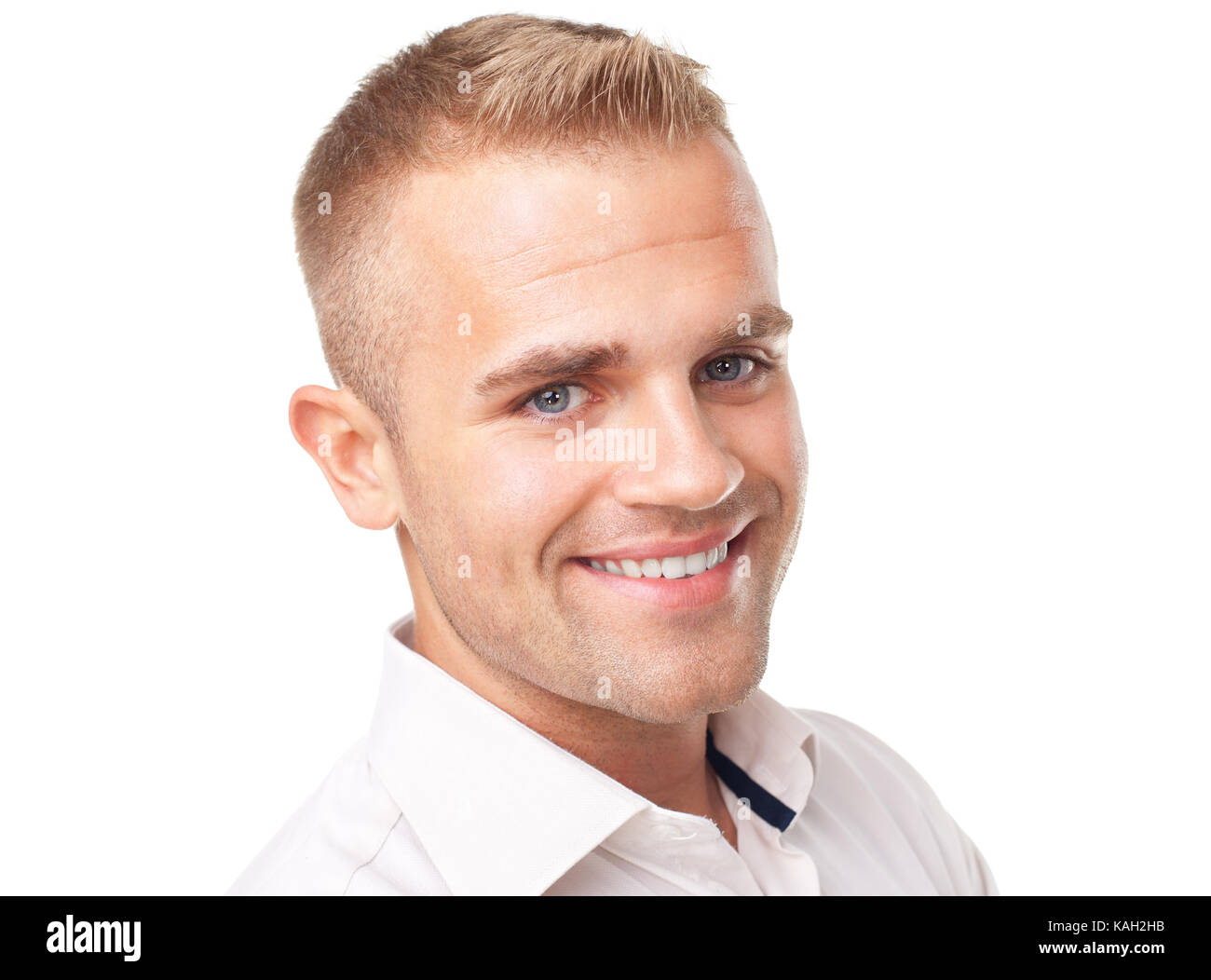 Portrait of happy smiling young man wearing a white shirt isolated on ...