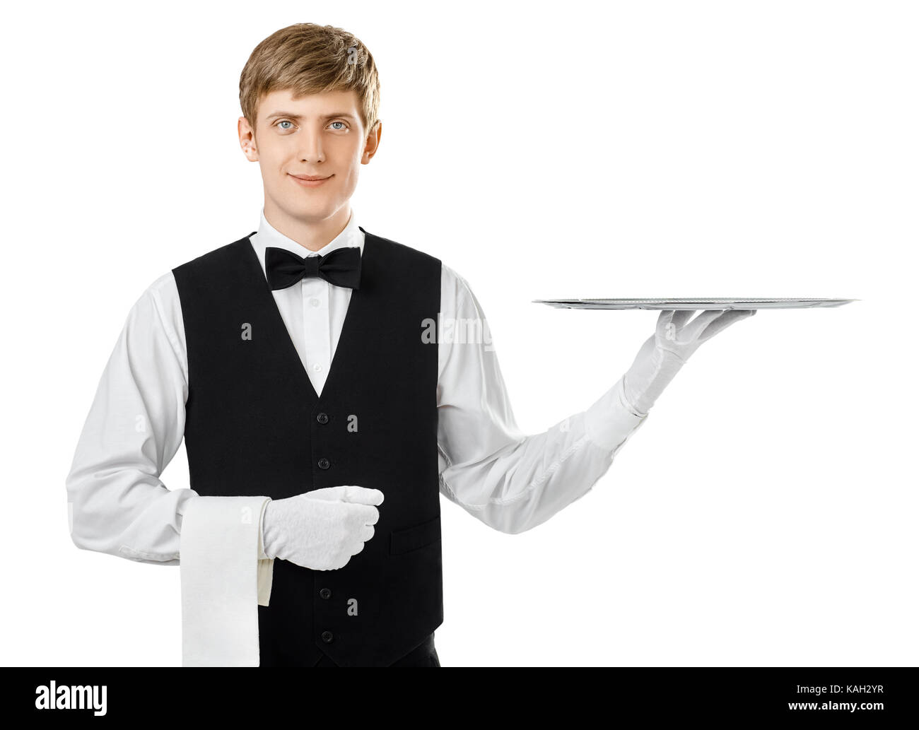 Portrait of young handsome waiter holding empty tray isolated on white background Stock Photo