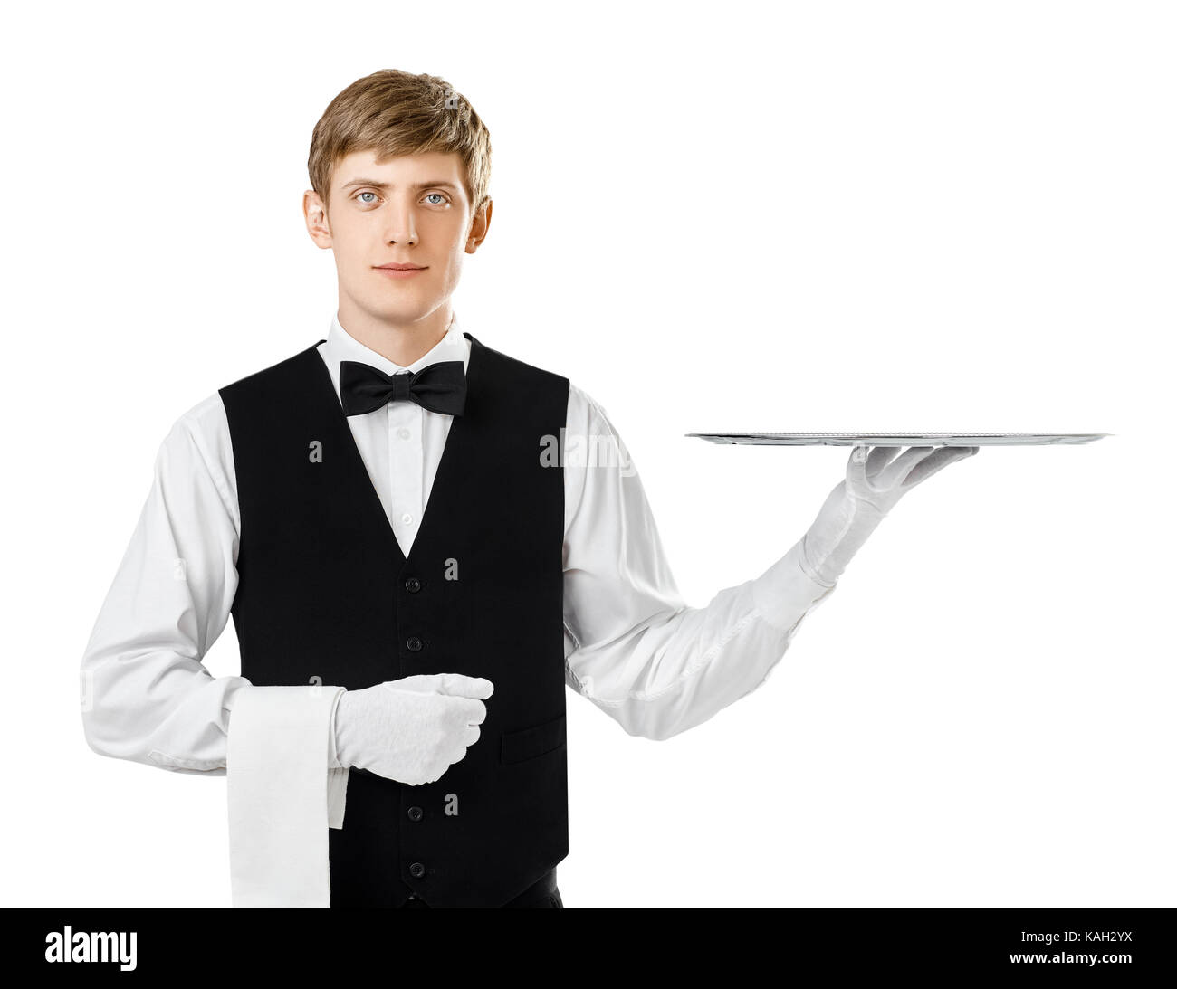 Portrait of young handsome waiter holding empty tray isolated on white background Stock Photo
