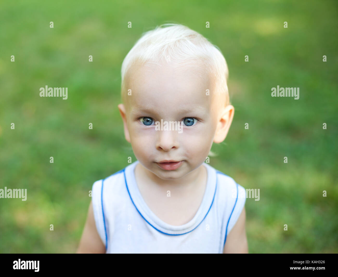 Portrait of a smiling little boy in the park Stock Photo - Alamy