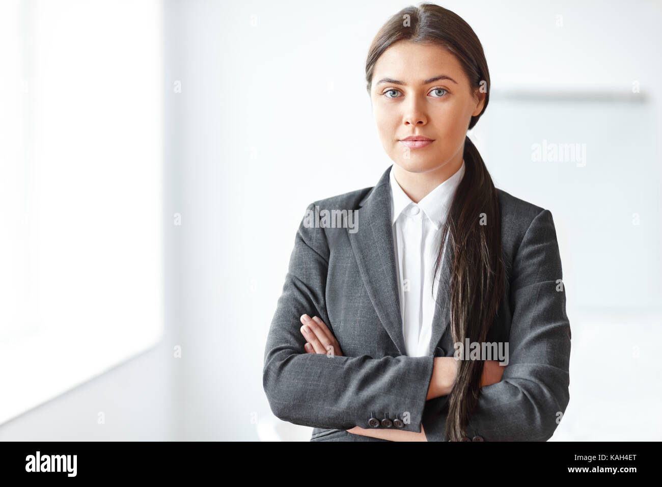 Portrait of young beautiful business woman in the office Stock Photo ...
